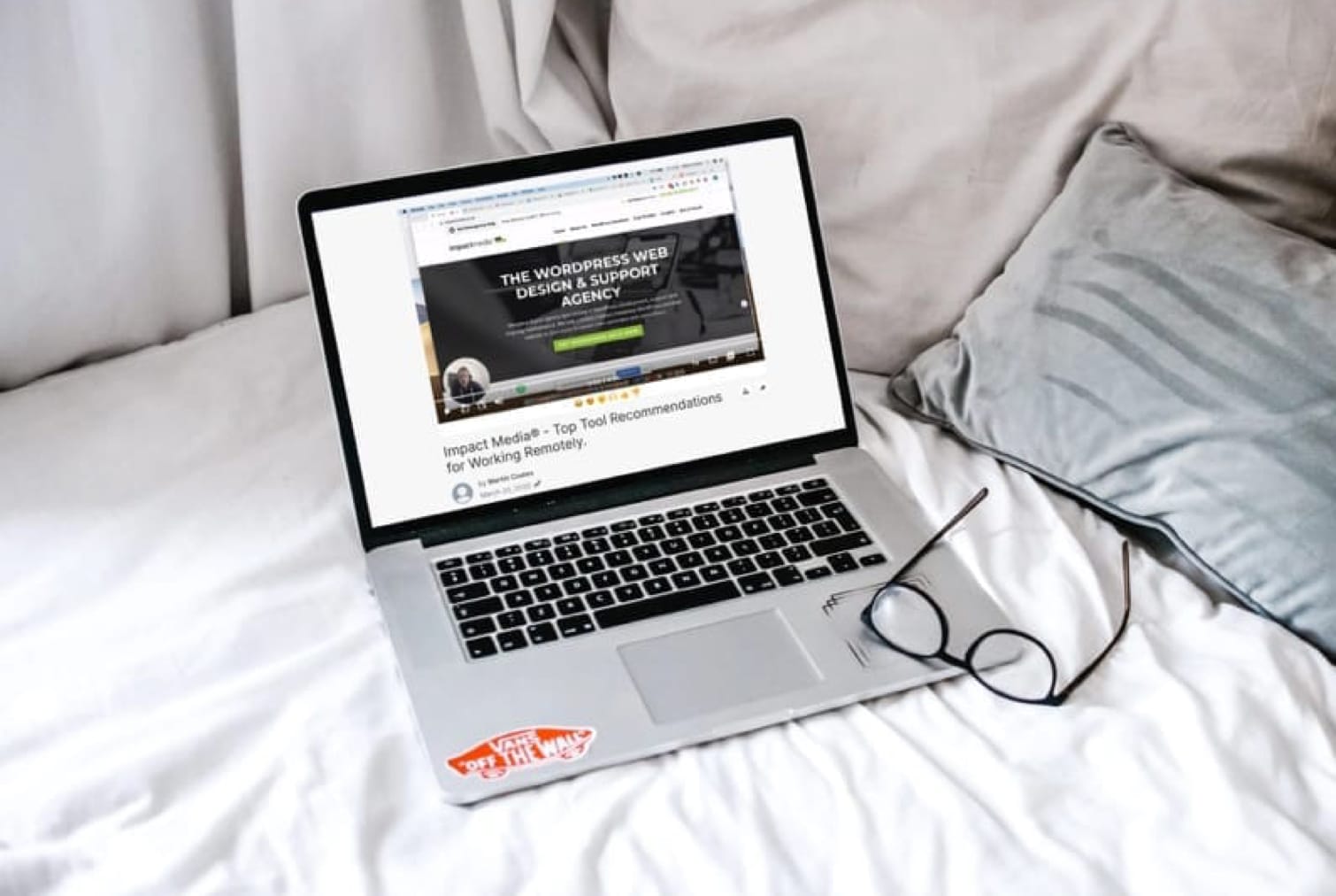 image of a laptop on a bed illustrating working from home